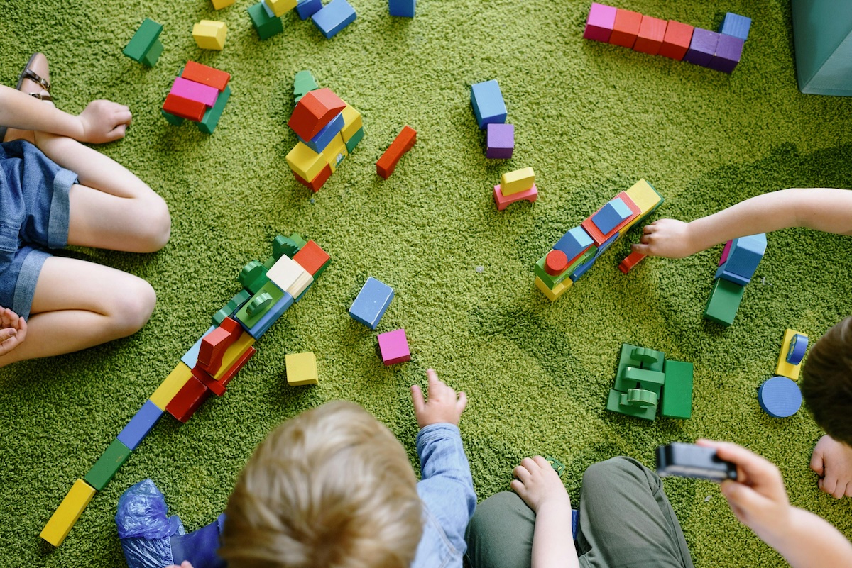 Kids playing with wood cubes